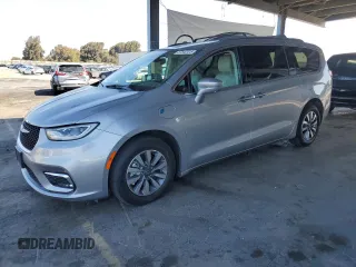 2021 Chrysler Pacifica Hybrid Touring L with VIN 2C4RC1L7XMR593911, listed as a Copart auction lot 57842415 with 74,910 mi miles and Salvage title. Bid and sale history available at DreamBid. Image 1.