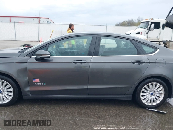 2015 Ford Fusion SE Hybrid with VIN 3FA6P0LU9FR232583, listed as a IAAI auction lot 42012175 with 139,309 mi miles and . Bid and sale history available at DreamBid. Image 14.
