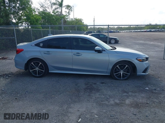 2023 Honda Civic Touring with VIN 2HGFE1F91PH305053, listed as a IAAI auction lot 42378311 with 41,576 mi miles and . Bid and sale history available at DreamBid. Image 14.