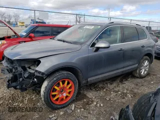 2014 Volkswagen Touareg Sport with VIN WVGEF9BPXED010212, listed as a Copart auction lot 46751935 with 121,017 mi miles and Salvage Title. Bid and sale history available at DreamBid. Image 1.
