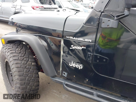 2002 Jeep Wrangler Sport with VIN 1J4FA49S02P705470, listed as a IAAI auction lot 42477770 with 59,395 mi miles and . Bid and sale history available at DreamBid. Image 12.