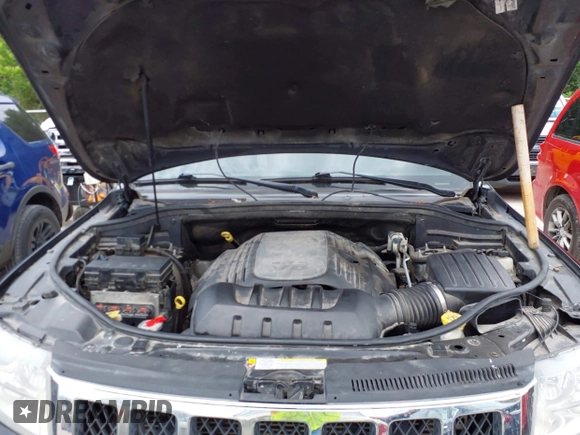 2013 Jeep Grand Cherokee Overland with VIN 1C4RJECT2DC588124, listed as a IAAI auction lot 42142573 with 204,309 mi miles and . Bid and sale history available at DreamBid. Image 10.