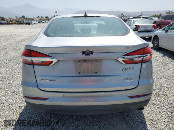 2020 Ford Fusion SEL z VIN 3FA6P0CD3LR196210, wystawiony jako Copart lot #60240925 z przebiegiem 81 768 mil mil oraz Szkoda całkowita • Salvage title. Historia ofert i sprzedaży dostępna na DreamBid. Obrazek 6.