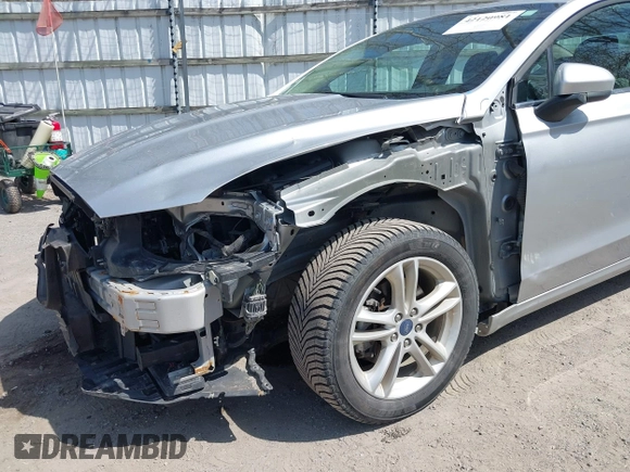2018 Ford Fusion SE z VIN 3FA6P0H77JR226390, wystawiony jako IAAI lot #42120981 z przebiegiem 114 057 mil mil oraz . Historia ofert i sprzedaży dostępna na DreamBid. Obrazek 6.