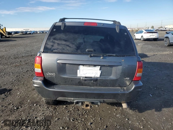 2003 Jeep Grand Cherokee Limited z VIN 1J8GW58N73C502929, wystawiony jako Copart lot #79472734 z przebiegiem 231 176 mil mil oraz Szkoda całkowita • Salvage title. Historia ofert i sprzedaży dostępna na DreamBid. Obrazek 6.