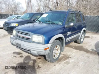 2004 Chevrolet Tracker ZR2 z VIN 2CNBJ734746917149, wystawiony jako IAAI lot #41649562 z przebiegiem 216 092 mil mil oraz . Historia ofert i sprzedaży dostępna na DreamBid. Obrazek 2.