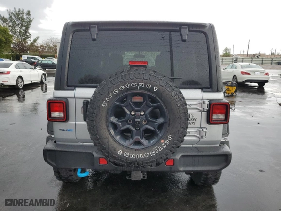 2023 Jeep Wrangler 4xe with VIN 1C4JJXN65PW661358, listed as a Copart auction lot 52500645 with 39,667 mi miles and Clean Title. Bid and sale history available at carsss.com. Image 6.