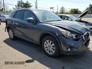 2016 Mazda CX-5 Touring with VIN JM3KE2CY2G0612029, listed as a Copart auction lot 53810155 with 159,915 mi miles and Salvage Title. Bid and sale history available at DreamBid. Image 4.