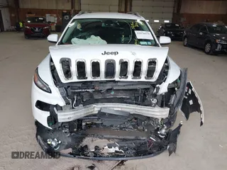 2014 Jeep Cherokee Altitude with VIN 1C4PJMCB7EW186432, listed as a IAAI auction lot 42076018 with 150,186 mi miles and . Bid and sale history available at DreamBid. Image 12.
