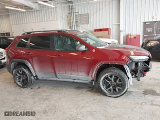 2016 Jeep Cherokee Trailhawk with VIN 1C4PJMBBXGW135138, listed as a IAAI auction lot 41595718 with 267,058 mi miles. Bid and sale history available at carsss.com. Image 13.