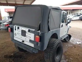 2006 Jeep Wrangler Sport with VIN 1J4FA49S46P748604, listed as a IAAI auction lot 41788157 with 128,249 mi miles. Bid and sale history available at carsss.com. Image 4.