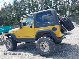 2003 Jeep Wrangler Rubicon with VIN 1J4FA69S93P302102, listed as a IAAI auction lot 42312951 with 146,408 mi miles and . Bid and sale history available at DreamBid. Image 14.