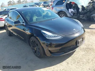 2018 Tesla Model 3 Long Range Battery with VIN 5YJ3E1EA0JF056979, listed as a IAAI auction lot 41865849 with 97,319 mi miles. Bid and sale history available at carsss.com. Image 1.