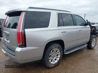 2015 GMC Yukon SLT with VIN 1GKS1BKC7FR628736, listed as a IAAI auction lot 41709926 with 130,254 mi miles. Bid and sale history available at carsss.com. Image 4.