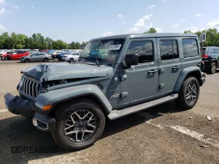 2024 Jeep Wrangler Sahara with VIN 1C4PJXEGXRW269062, listed as a Copart auction lot 64576895 with 2,159 mi miles and Salvage title. Bid and sale history available at DreamBid. Image 1.