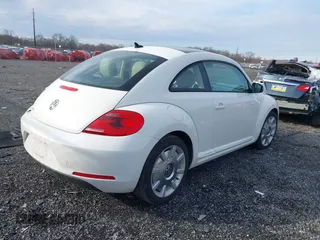 2014 Volkswagen Beetle 2.5L w/Sun with VIN 3VWJP7AT8EM611560, listed as a IAAI auction lot 41488488 with 140,798 mi miles and . Bid and sale history available at DreamBid. Image 4.