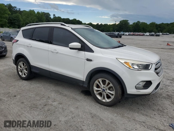 2017 Ford Escape SE z VIN 1FMCU0G99HUA75866, wystawiony jako Copart lot #57274785 z przebiegiem 132 874 mil mil oraz Czysty tytuł • Clean title. Historia ofert i sprzedaży dostępna na DreamBid. Obrazek 4.