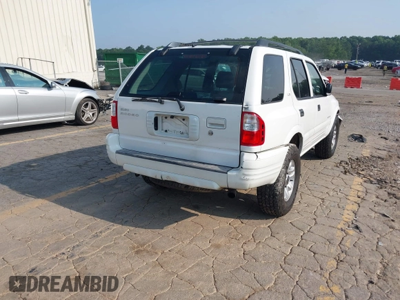 2002 Isuzu Rodeo S with VIN 4S2CK58W524321108, listed as a IAAI auction lot 42352330 with 270,614 mi miles and . Bid and sale history available at DreamBid. Image 4.