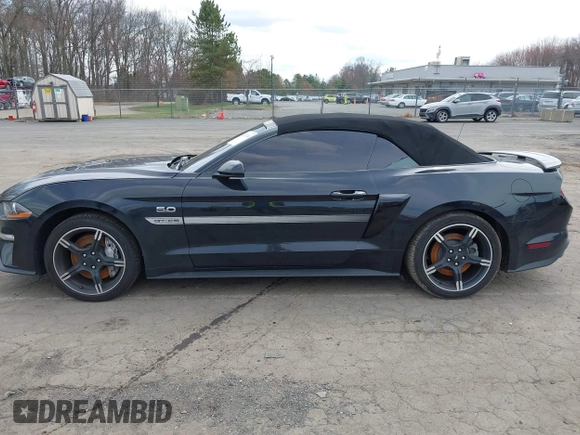 2021 Ford Mustang GT Premium with VIN 1FATP8FF4M5143096, listed as a IAAI auction lot 42013344 with 20,221 mi miles and . Bid and sale history available at DreamBid. Image 14.