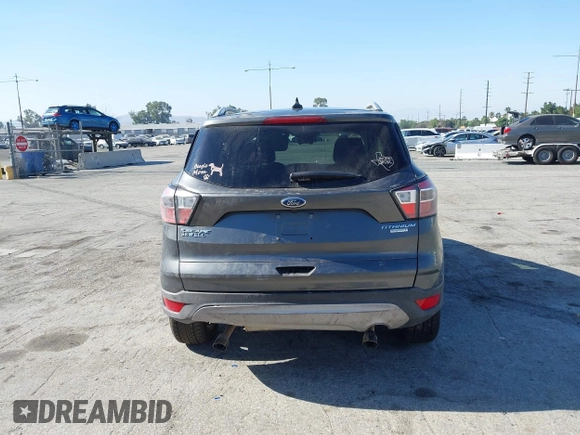 2018 Ford Escape Titanium with VIN 1FMCU0J98JUA03474, listed as a IAAI auction lot 37677880 with 106,423 mi miles and . Bid and sale history available at DreamBid. Image 16.
