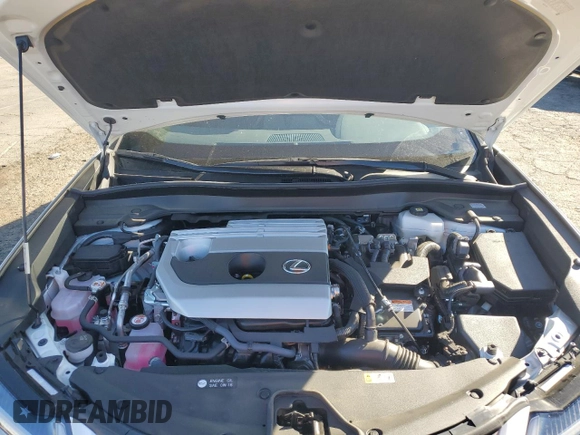 2024 Lexus UX with VIN JTHX6JBH0R2188086, listed as a Copart auction lot 79203964 with 7,703 mi miles and Salvage Title. Bid and sale history available at carsss.com. Image 12.