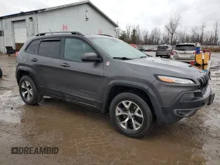 2014 Jeep Cherokee Trailhawk with VIN 1C4PJMBB6EW310613, listed as a Copart auction lot 46438185 with 122,113 mi miles and Salvage Title. Bid and sale history available at carsss.com. Image 4.