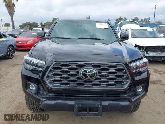 2023 Toyota Tacoma SR z VIN 3TMCZ5AN4PM548729, wystawiony jako IAAI lot #42078723 z przebiegiem 30 966 mil mil oraz . Historia ofert i sprzedaży dostępna na DreamBid. Obrazek 11.
