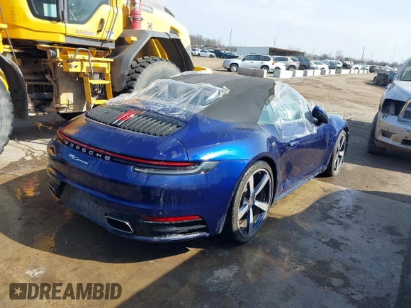 2022 Porsche 911 Carrera with VIN WP0CA2A96NS236957, listed as a IAAI auction lot 41154002 with 34,056 mi miles and . Bid and sale history available at DreamBid. Image 4.