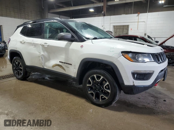 2019 Jeep Compass Trailhawk with VIN 3C4NJDDB5KT703542, listed as a Copart auction lot 54506705 with 86,178 mi miles and Salvage Title. Bid and sale history available at DreamBid. Image 4.