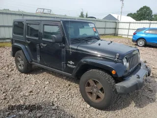 2015 Jeep Wrangler Unlimited Freedom with VIN 1C4BJWDG4FL568601, listed as a Copart auction lot 64041415 with 128,874 mi miles and Salvage title. Bid and sale history available at DreamBid. Image 4.