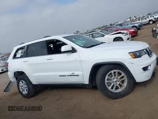 2020 Jeep Grand Cherokee Laredo E with VIN 1C4RJEAG4LC245884, listed as a IAAI auction lot 42564754 with 63,356 mi miles and . Bid and sale history available at DreamBid. Image 14.