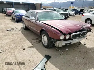 1998 Jaguar XJ Vanden Plas with VIN SAJKX6245WC830912, listed as a Copart auction lot 49717285 with 127,509 mi miles and Salvage Title. Bid and sale history available at DreamBid. Image 10.