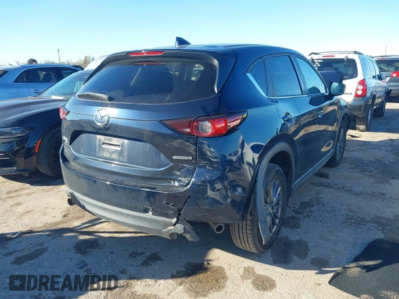 2021 Mazda CX-5 Touring with VIN JM3KFBCM3M1454879, listed as a IAAI auction lot 41311785 with 39,020 mi miles. Bid and sale history available at carsss.com. Image 4.