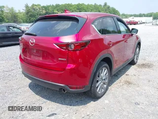2021 Mazda CX-5 Grand Touring with VIN JM3KFBDM3M0434569, listed as a IAAI auction lot 42422349 with 25,924 mi miles and . Bid and sale history available at DreamBid. Image 4.