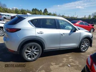 2021 Mazda CX-5 Grand Touring with VIN JM3KFBDM3M1300316, listed as a IAAI auction lot 41878520 with 77,670 mi miles and . Bid and sale history available at DreamBid. Image 13.