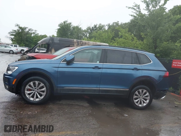 2018 Volkswagen Tiguan SEL with VIN 3VV2B7AX4JM019965, listed as a IAAI auction lot 42395783 with 107,822 mi miles and . Bid and sale history available at DreamBid. Image 14.