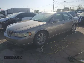2003 Cadillac Seville Touring STS z VIN 1G6KY54943U118351, wystawiony jako Copart lot #74207414 z przebiegiem 55 204 mil mil oraz Szkoda całkowita • Salvage title. Historia ofert i sprzedaży dostępna na DreamBid. Obrazek 1.