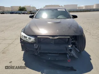 2015 BMW M4 with VIN WBS3R9C50FK333819, listed as a Copart auction lot 61105565 with 168,932 mi miles and Salvage title. Bid and sale history available at DreamBid. Image 5.