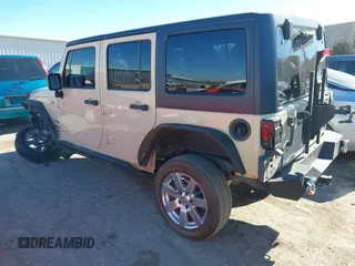 2012 Jeep Wrangler Unlimited Sport z VIN 1C4BJWDG8CL102486, wystawiony jako IAAI lot #41386649 z przebiegiem 156 993 mil mil oraz . Historia ofert i sprzedaży dostępna na DreamBid. Obrazek 3.