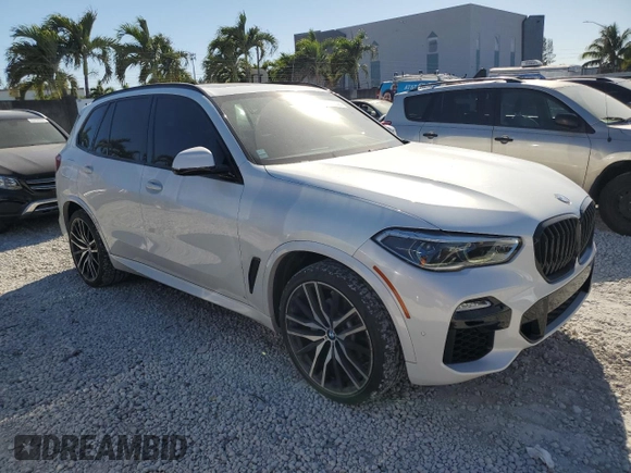 2019 BMW X5 xDrive40i with VIN 5UXCR6C50KLK86199, listed as a Copart auction lot 47523305 with 76,924 mi miles and Salvage Title. Bid and sale history available at DreamBid. Image 4.