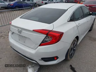 2020 Honda Civic LX with VIN 19XFC2F62LE021811, listed as a IAAI auction lot 41591466 with 75,797 mi miles and . Bid and sale history available at DreamBid. Image 4.