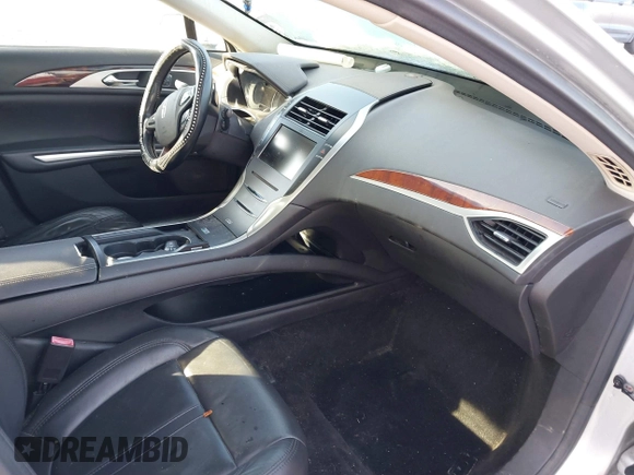 2014 Lincoln MKZ z VIN 3LN6L2G99ER825605, wystawiony jako IAAI lot #41296771 z przebiegiem 195 838 mil mil oraz . Historia ofert i sprzedaży dostępna na DreamBid. Obrazek 5.