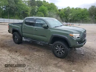 2021 Toyota Tacoma SR with VIN 3TYCZ5AN9MT010768, listed as a Copart auction lot 53961455 with 55,822 mi miles and Salvage title. Bid and sale history available at DreamBid. Image 4.
