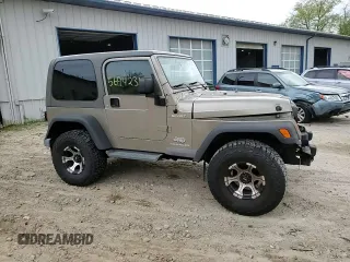 2005 Jeep Wrangler Sport z VIN 1J4FA49S75P325028, wystawiony jako Copart lot #56942315 z przebiegiem 169 988 mil mil oraz Szkoda całkowita • Salvage title. Historia ofert i sprzedaży dostępna na DreamBid. Obrazek 13.