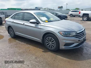 2021 Volkswagen Jetta S z VIN 3VWC57BU4MM094780, wystawiony jako IAAI lot #42103554 z przebiegiem 49 044 mil mil oraz . Historia ofert i sprzedaży dostępna na DreamBid. Obrazek 1.