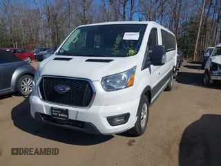 2021 Ford Transit Passenger XL with VIN 1FBAX2Y83MKA49312, listed as a IAAI auction lot 41806818 with 71,286 mi miles. Bid and sale history available at carsss.com. Image 2.