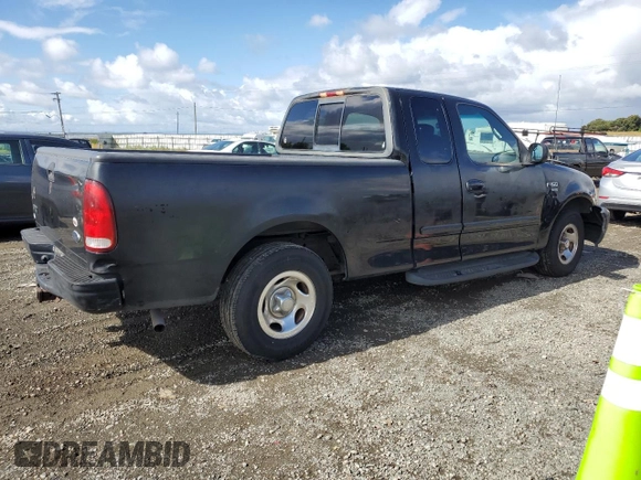 2001 Ford F-150 XL with VIN 1FTRX17W91NB71630, listed as a Copart auction lot 56583545 with 209,009 mi miles and Salvage title. Bid and sale history available at DreamBid. Image 3.
