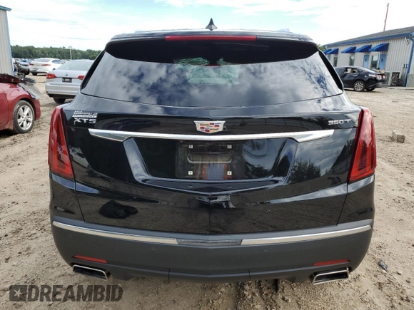 2023 Cadillac XT5 FWD Luxury z VIN 1GYKNAR40PZ106096, wystawiony jako Copart lot #80909074 z przebiegiem 19 677 mil mil oraz Nie do naprawy • Non repairable. Historia ofert i sprzedaży dostępna na DreamBid. Obrazek 6.