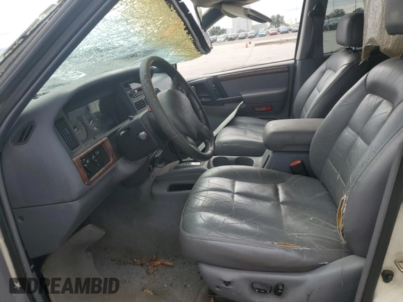 1997 Jeep Grand Cherokee Limited with VIN 1J4GX78YXVC716353, listed as a Copart auction lot 85207974 with 115,527 mi miles and Salvage Title. Bid and sale history available at carsss.com. Image 7.