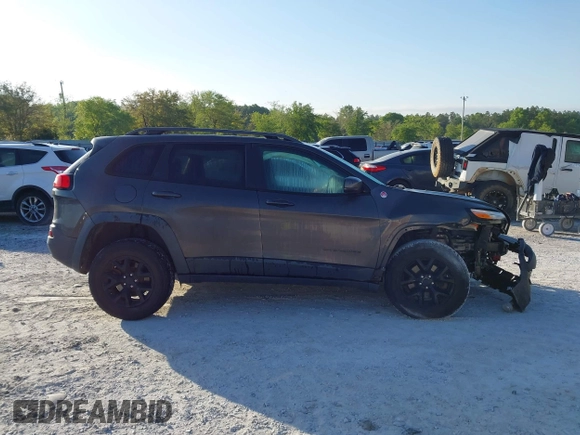 2018 Jeep Cherokee Trailhawk with VIN 1C4PJMBX7JD517299, listed as a IAAI auction lot 42022770 with 62,865 mi miles. Bid and sale history available at carsss.com. Image 14.